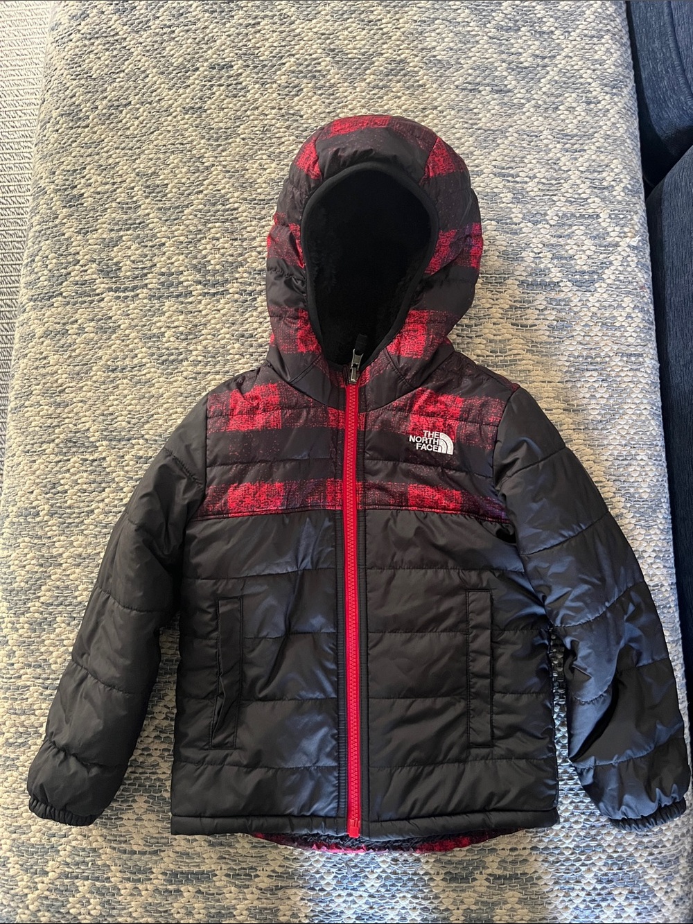 The North Face Kids Black Jacket with Red Plaid Accents